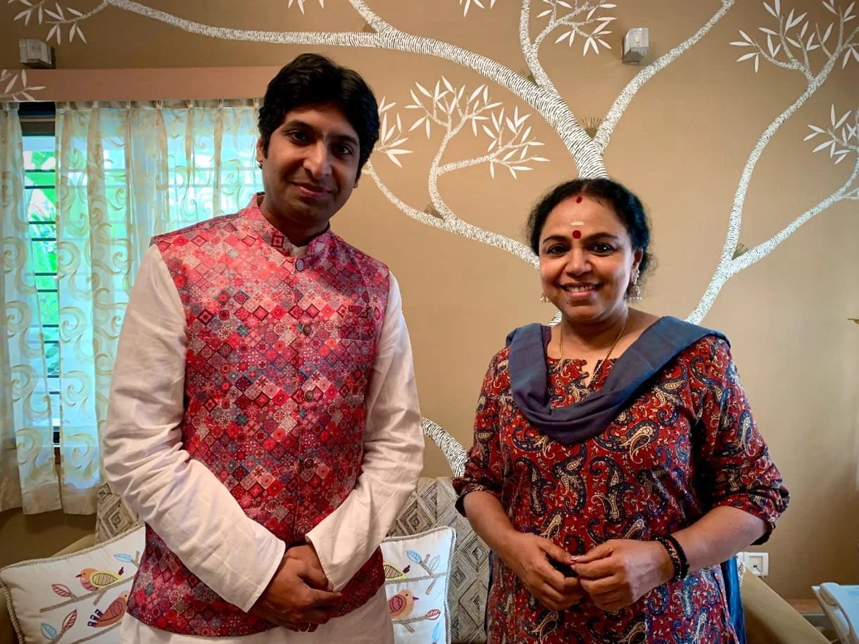 Dr. Koustubh Pare with a fellow artist in a warm interior
