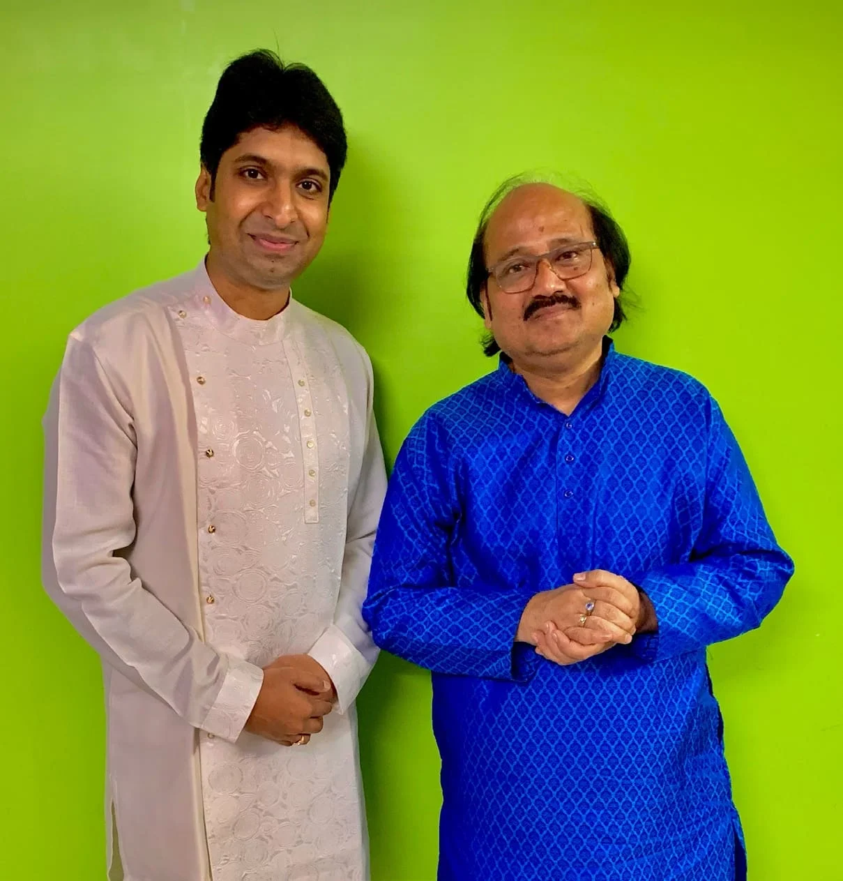 Dr. Koustubh Pare with a fellow musician in a studio portrait